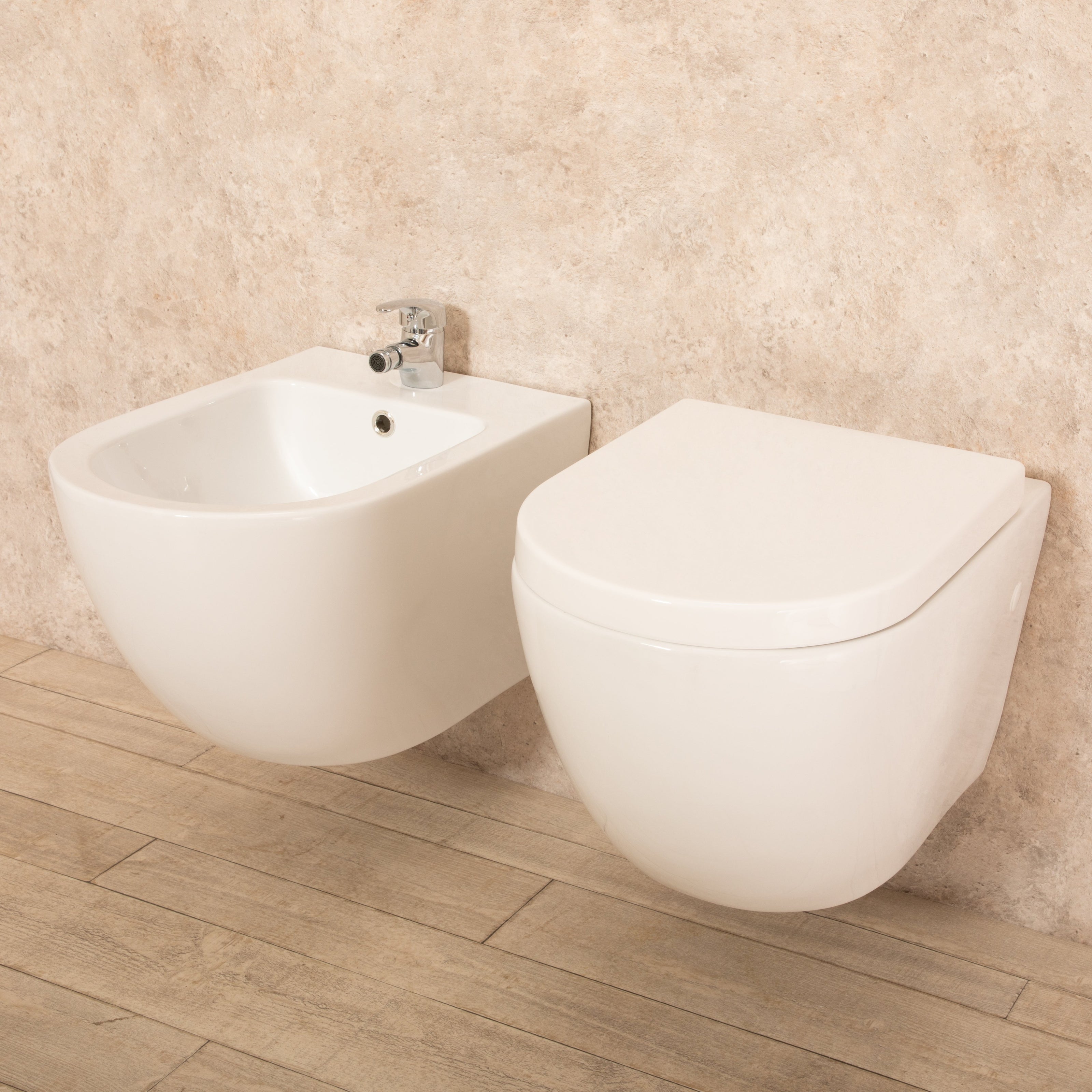 Sanitari Sospesi Vortix in Ceramica Wc senza brida Tavoletta e Bidet